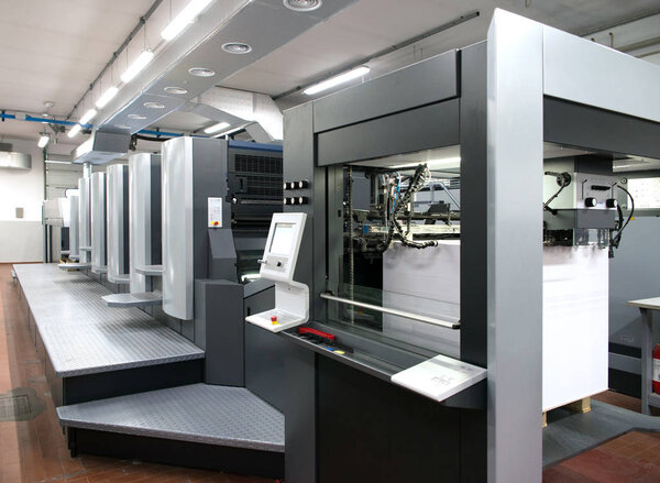 Press printing - Offset machine. Printing technique where the inked image is transferred from a plate to a rubber blanket, then to the printing surface.