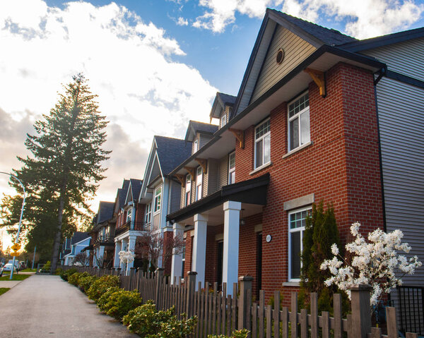 Row of Typical English Terraced Houses. Red brick homes side by side.