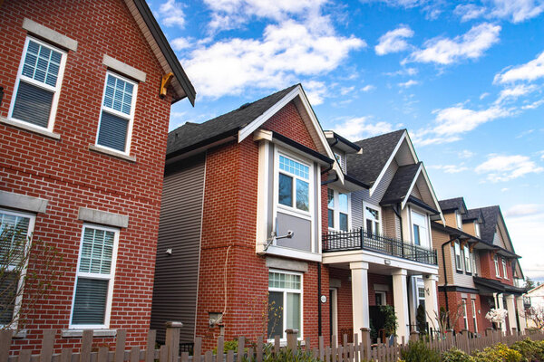 Row of Typical English Terraced Houses. Red brick homes side by side.