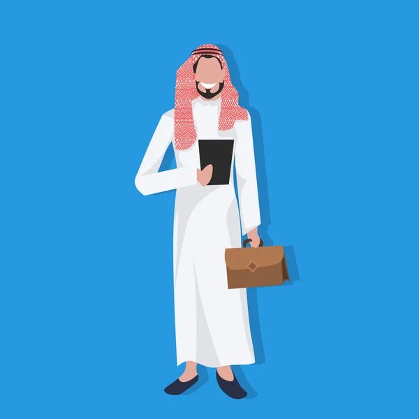 Arabic business man holding tablet suitcase wearing traditional clothes online communication concept arab businessman male cartoon character avatar flat full length — Stock Vector