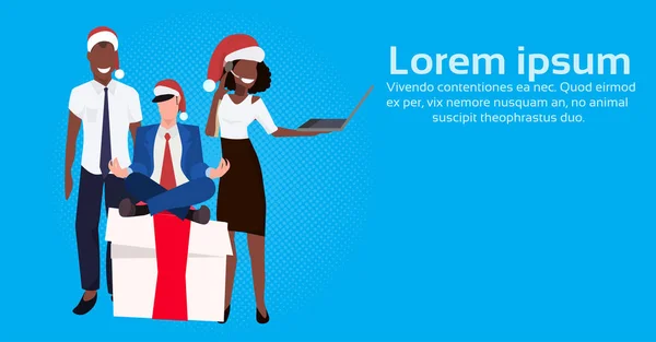 mix race business people wearing red hat sitting lotus pose gift box present using laptop female male cartoon character flat horizontal