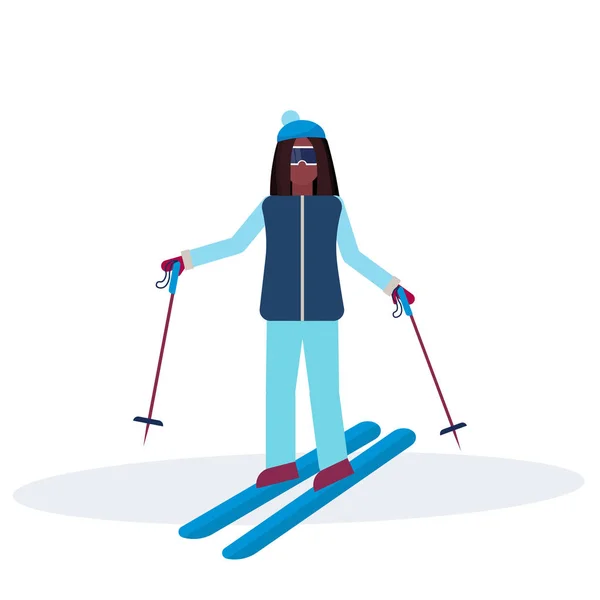 Woman skiing sport activities lady wearing goggles ski suit female carton character sportswoman on skis full length flat isolated — Stock Vector