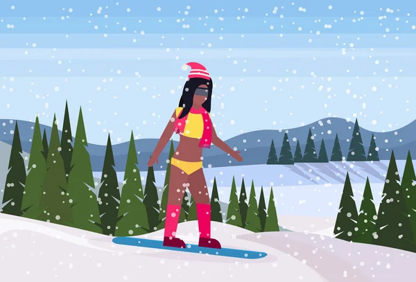 Sexy snowboarder femme en maillot de bain glissant vers le bas hiver enneigé montagne sapin forêt paysage fond ski station horizontale plat — Image vectorielle
