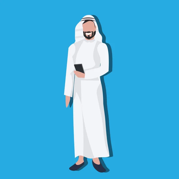 Arabic business man using smartphone wearing traditional clothes arab businessman male cartoon character avatar blue background full length flat — Stock Vector