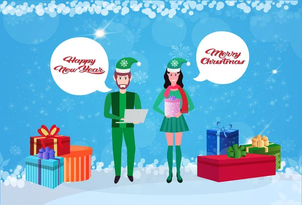 Couple man woman wearing elf costume chat bubble happy new year merry christmas concept gift boxes decoration flat horizontal banner — Stock Vector
