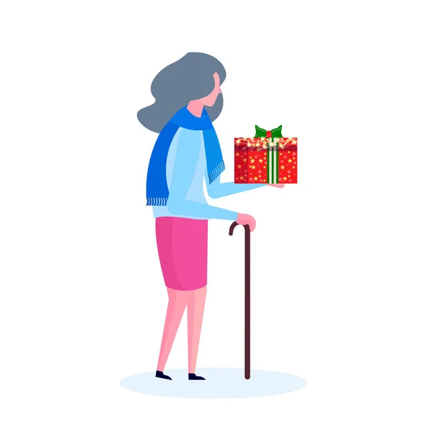 senior woman with stick holding gift box happy new year merry christmas concept female cartoon character profile full length isolated