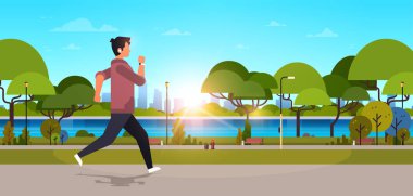 kulaklık spor etkinlik kavramı cityscape günbatımı arka plan yatay banner düz koşma koşu açık havada modern kamu parki adam genç adam