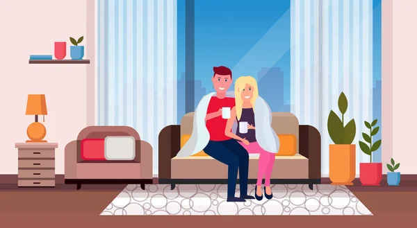 Paar trinkt Tee Mann Frau sitzt auf der Couch unter gemütlichen karierten glücklichen Liebhabern entspannen moderne Wohnung Wohnzimmer Interieur männliche weibliche Charaktere volle Länge horizontal — Stockvektor