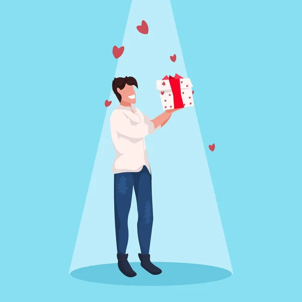 Man holding gift box wrapped surprise happy valentines day holiday celebration concept guy standing over heart shapes blue background male full length character flat — 스톡 벡터