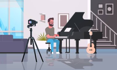 adam müzik blogger kayıt klasik piyano müzik blog kavramı modern daire iç tam uzunlukta yatay oynarken kamera adam video
