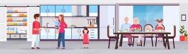 Çoklu nesil aile mutlu dedesi ebeveynler ve çocuklar modern mutfak iç yemek yuvarlak masa tam uzunlukta düz yatay banner toplama kahvaltı