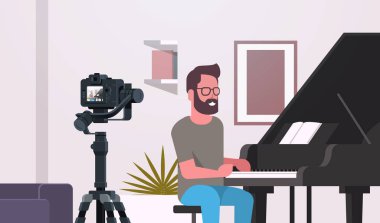 adam müzik blogger kayıt klasik piyano müzik blog kavramı modern daire iç portre yatay oynarken kamera adam video