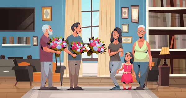 Feliz familia multi generación felicitando a las mujeres con internacional 8 marzo concepto de día de los hombres dando flores sala de estar interior de longitud completa horizontal plana — Vector de stock