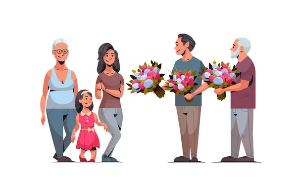 Lycklig multi generation familj gratulera kvinnor med internationella 8 mars dag konceptet män ger blommor manliga kvinnliga karaktärer full längd horisontella — Stock vektor