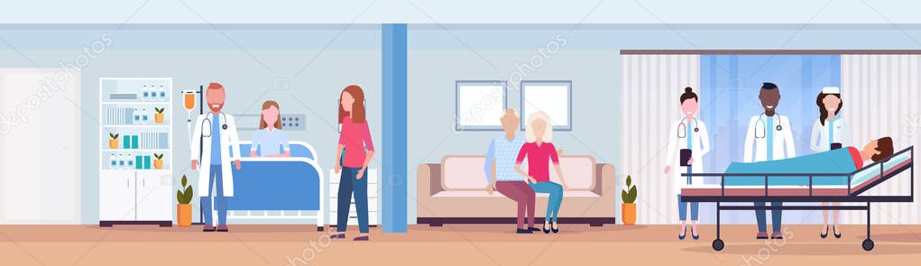 mix race doctors visiting patients man woman lying in bed intensive therapy ward healthcare concept hospital room interior modern medical clinic horizontal banner