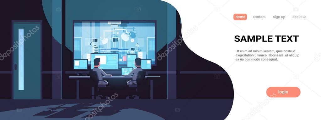 two men looking at monitors sitting behind glass window hospital operating table medical surgery room dark office interior surveillance security system flat horizontal copy space