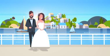 yeni evliler erkek kadın birlikte romantik çift gelin ve damat kucaklayan düğün günü kavramı dağ şehir ada manzara yatay