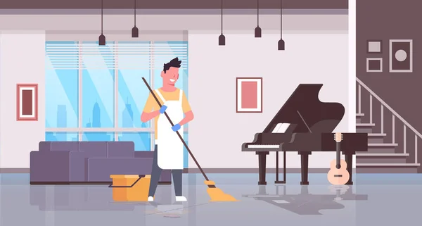 Man in gloves and apron washing floor guy using mop doing housework cleaning concept modern house living room interior flat horizontal full length — Stock Vector