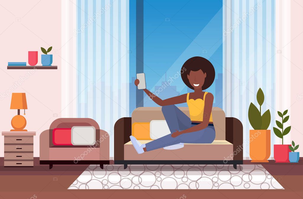 woman sitting on couch girl taking selfie photo on smartphone camera modern living room interior african american female cartoon character flat full length horizontal