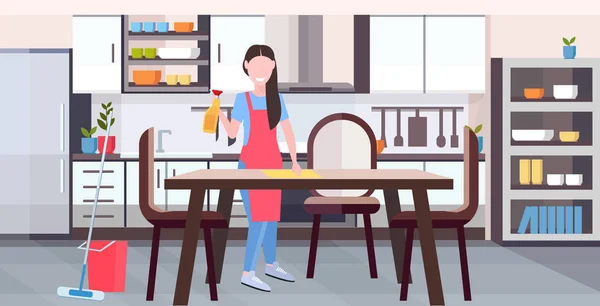 Ama de casa en delantal limpiando mesa de comedor por chica de paño de polvo haciendo tareas domésticas servicio de limpieza concepto de larga duración plana cocina moderna interior horizontal — Vector de stock