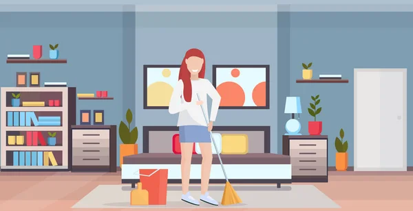 Housewife holding broom woman cleaner doing housework sweeping floor cleaning housekeeping concept full length flat modern bedroom interior horizontal — Stock Vector