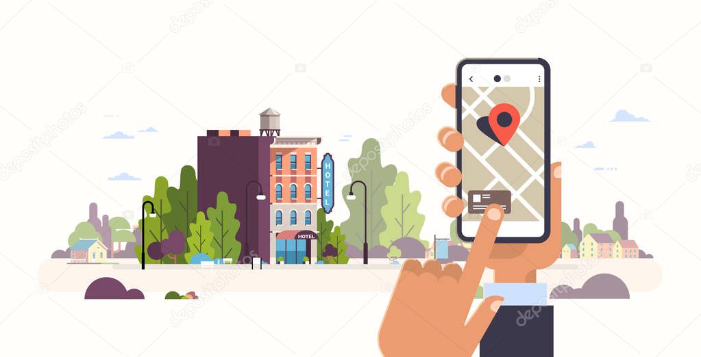 hand holding smartphone hotel booking concept hostel building exterior mobile app gps searching point on city map cityscape background flat horizontal banner