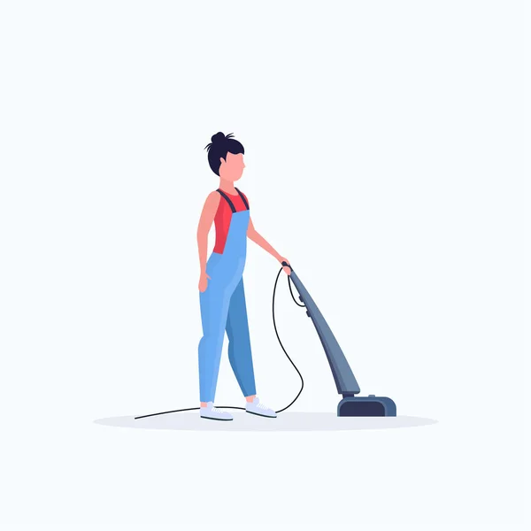 Woman using vacuum cleaner female janitor in uniform cleaning service floor care concept flat full length white background — 스톡 벡터