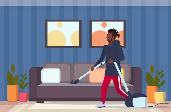 Man using vacuum cleaner african american guy vacuuming couch doing housework housekeeping cleaning service concept modern living room interior full length flat horizontal — Stock Vector