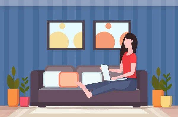 Woman sitting on couch using laptop social media network communication digital gadget addiction concept modern living room interior flat full length horizontal — Stock Vector