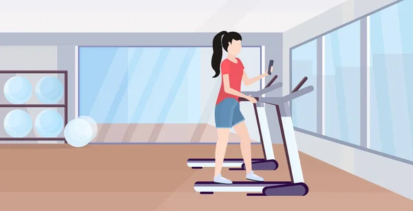 Woman running on treadmill girl using smartphone while training workout digital gadget addiction concept modern gym studio interior flat full length horizontal — ストックベクタ