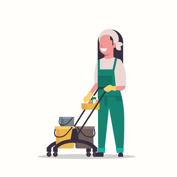 Femme tenant chariot chariot avec fournitures femme nettoyeur concierge en uniforme concept de service de nettoyage plat pleine longueur — Image vectorielle