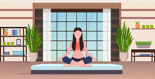 Young woman doing yoga exercises smiling sport fitness girl sitting lotus pose meditation relaxation concept modern gym interior full length horizontal — Stock Vector