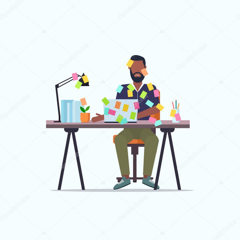 businessman covered with stick notes business planning deadline concept african american office worker using laptop sitting at workplace flat full length