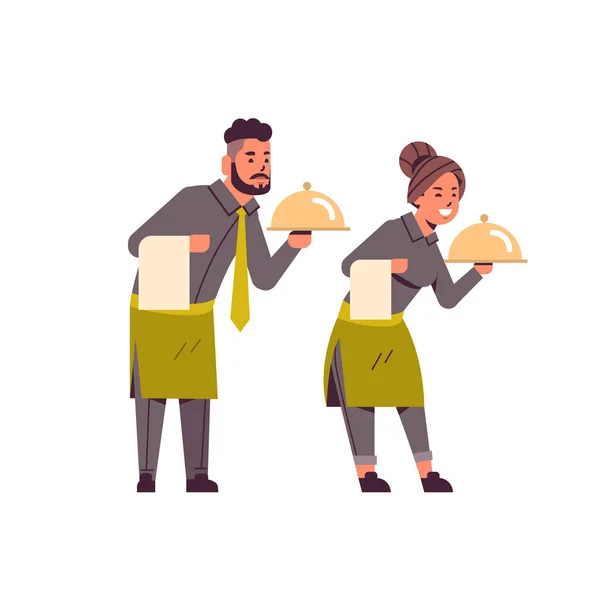 Professional waiters couple holding dish man woman restaurant workers in uniform with tray and towel food serving concept flat full length white background — Stock Vector