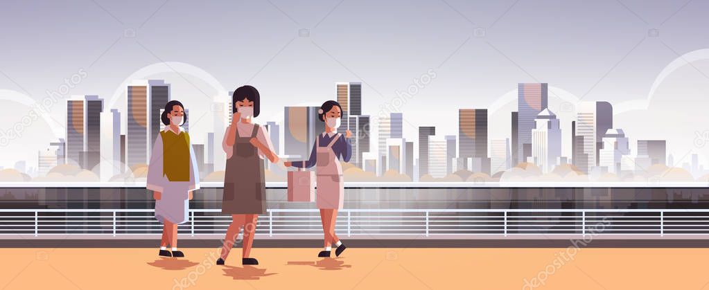 women wearing face masks environmental industrial smog dust toxic air pollution virus protection concept girls walking outdoor city building cityscape skyline background full length horizontal