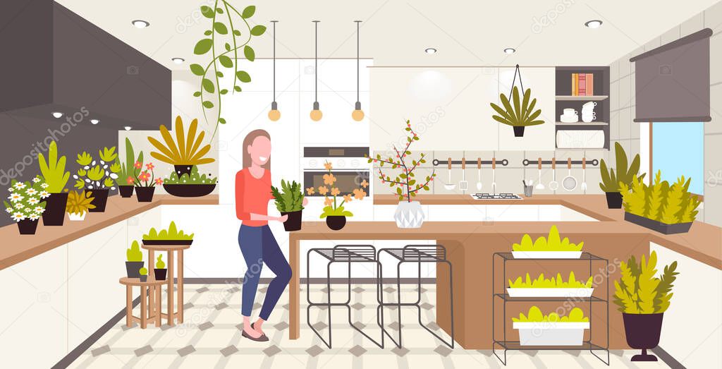 woman taking care of houseplants girl enjoying ecology hobby stay home lifestyle kitchen interior