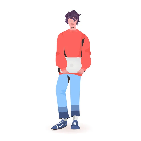 Man håller laptop kille modell i trendiga kläder manliga tecknad karaktär stående pose full längd — Stock vektor
