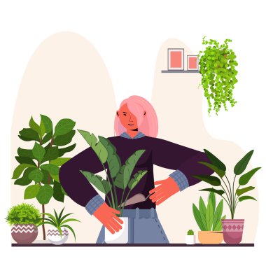 Kadın, saksıya çiçek ekiyor ev hanımı bitkileriyle ilgileniyor.