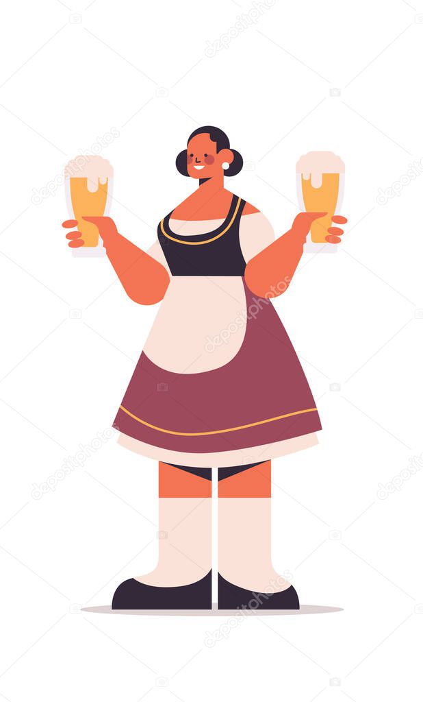 girl waitress holding beer mugs Oktoberfest party concept woman in german traditional clothes having fun