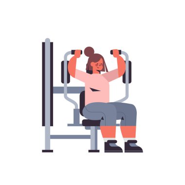 Sporcu kadın spor salonundaki sağlıklı yaşam tarzında fiziksel egzersiz yapan kız üzerinde egzersiz yapıyor.