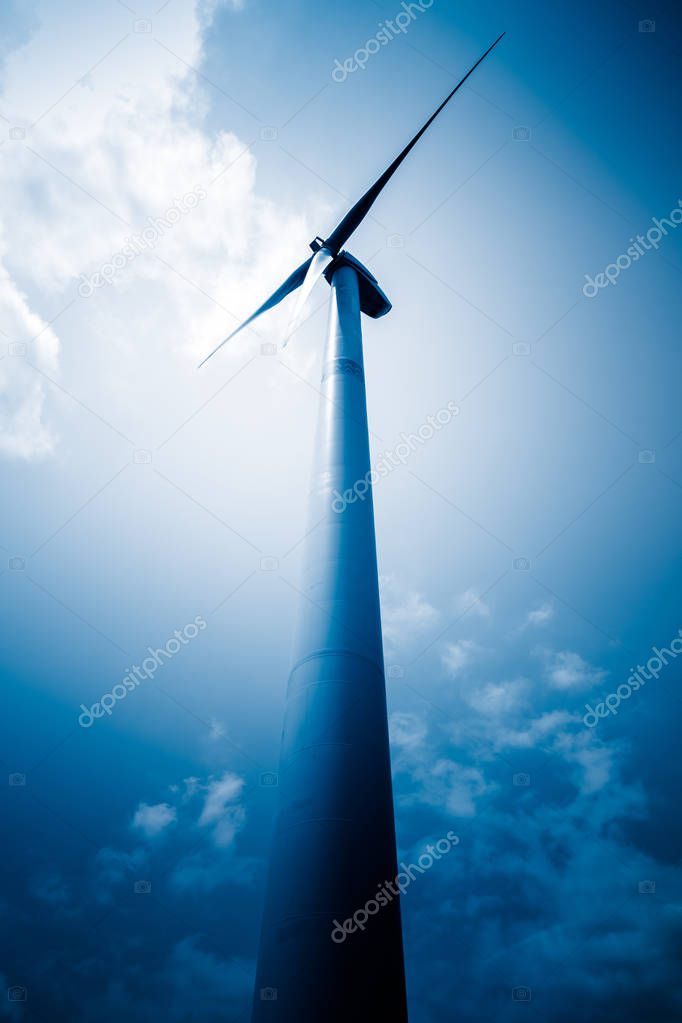 wind generators aganist the blue sky, blue toned.