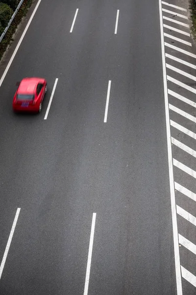 stock image car on the clean road outside.