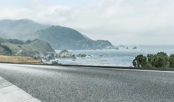 clean highway go aside the bay of ocean, california, usa.