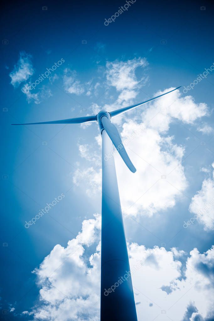 wind generators aganist the blue sky, blue toned.