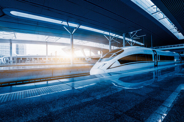 speeding train away from railway station, shanghai china.