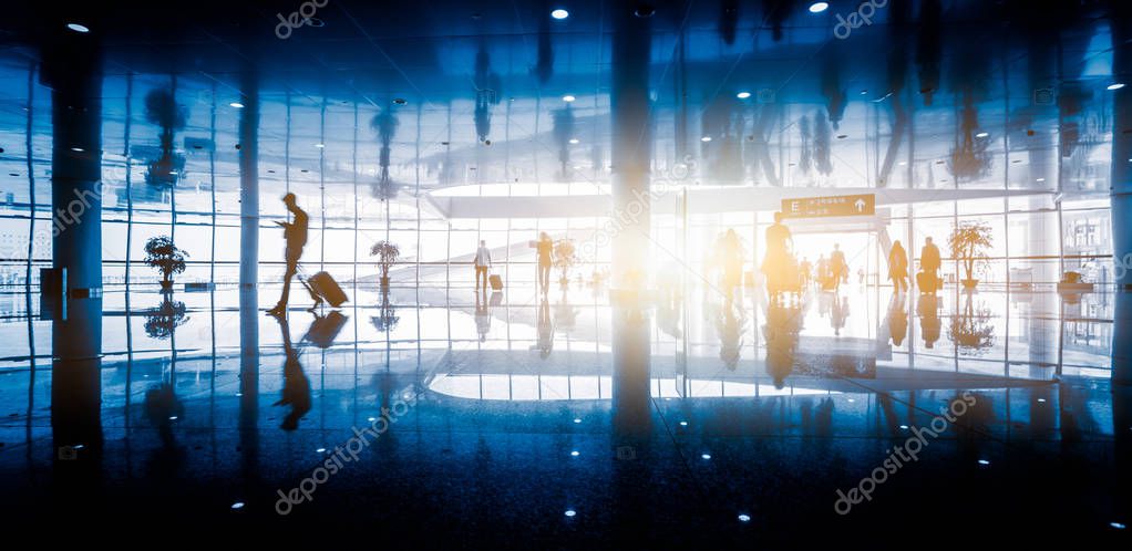 Airport terminal hall. Walking travelers at shanghai airport.