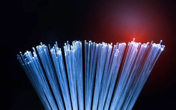 Fiber Optics kabel met verlichting abstracte achtergrond — Stockfoto