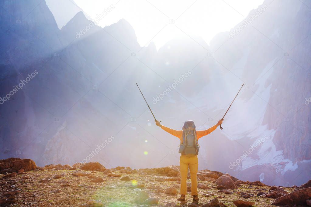 Wanderlust time. Man hiking in beautiful Fann mountains in Pamir, Tajikistan. Central Asia.