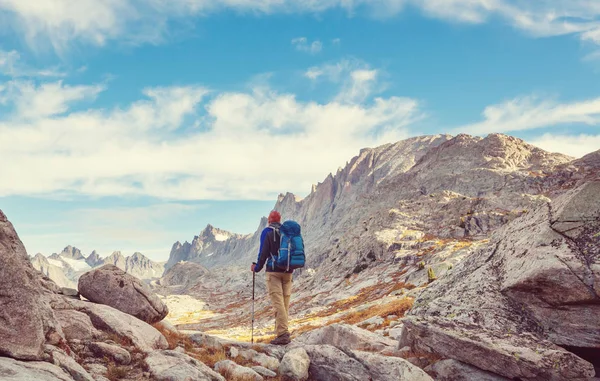 Hiker in Wind River Range in Wyoming, USA. Autumn season.