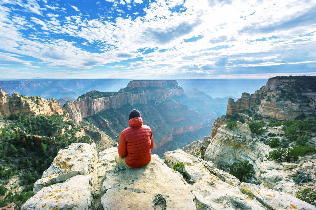 Traveler on cliff mountains over Grand Canyon National Park, Arizona, USA.Inspiring emotion. Travel Lifestyle journey success motivation concept adventure  vacations outdoor concept.